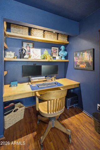 Built in desk and shelves in this 3rd bedroom or office. Hard wood look flooring matches flooring in the other 2 bedrooms