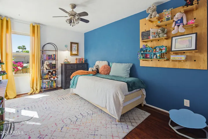Bedroom 2 whimsical touches and tasteful paint and wood look flooring