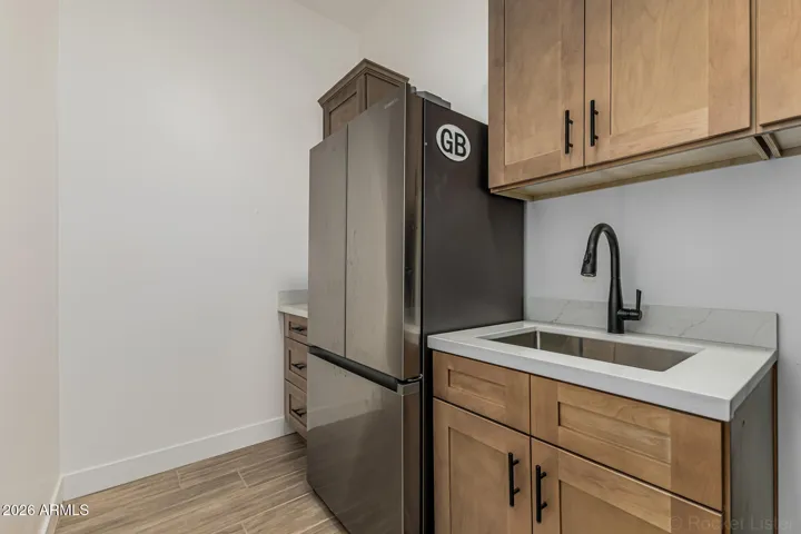 Designated space & outlet for refrigerator in laundry room