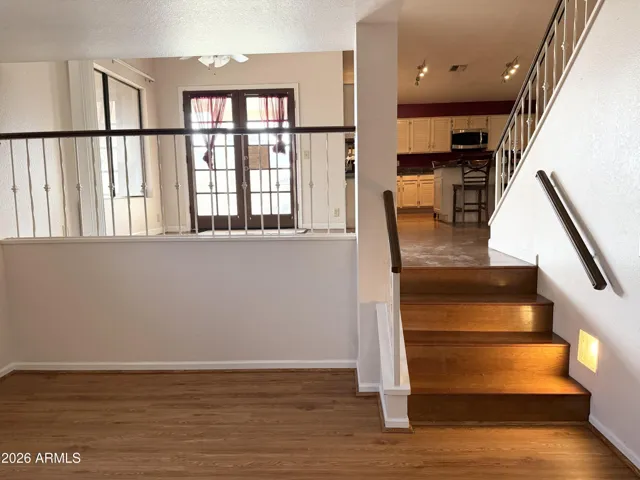 Downstairs looking up to the breakfast area and kitchen.