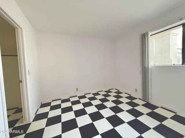Downstairs bedroom with walk-in closet