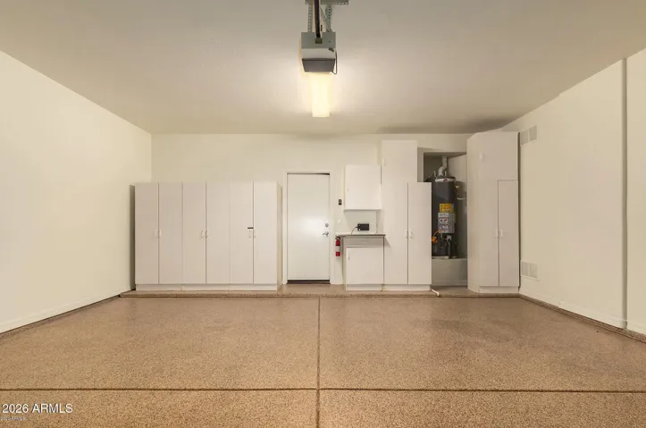 2 Car garage with epoxy floor, new water softener, and built in storage.