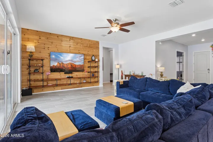 Warm wood feature wall anchors the living space