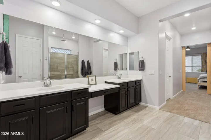 Large dual vanity with dedicated seated makeup station