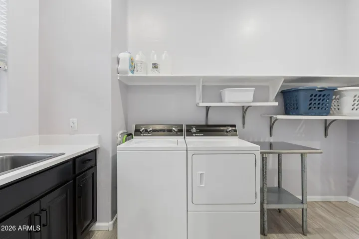 Large laundry room with built-in sink and dual access