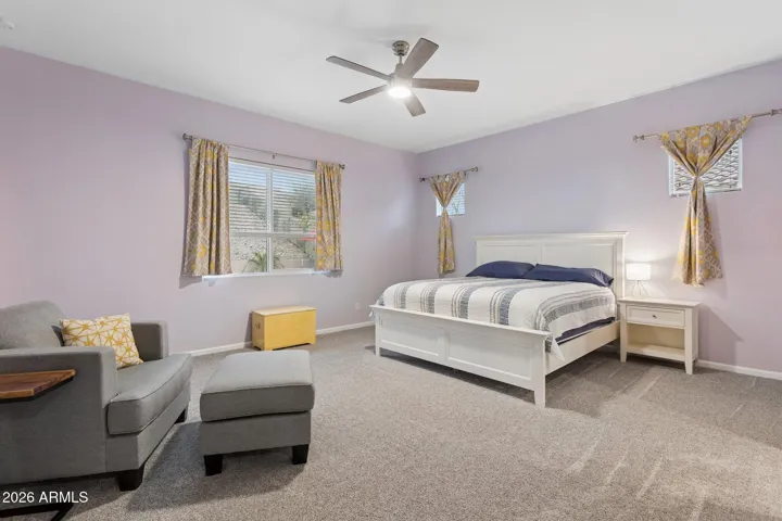 Large primary bedroom with direct access to the backyard