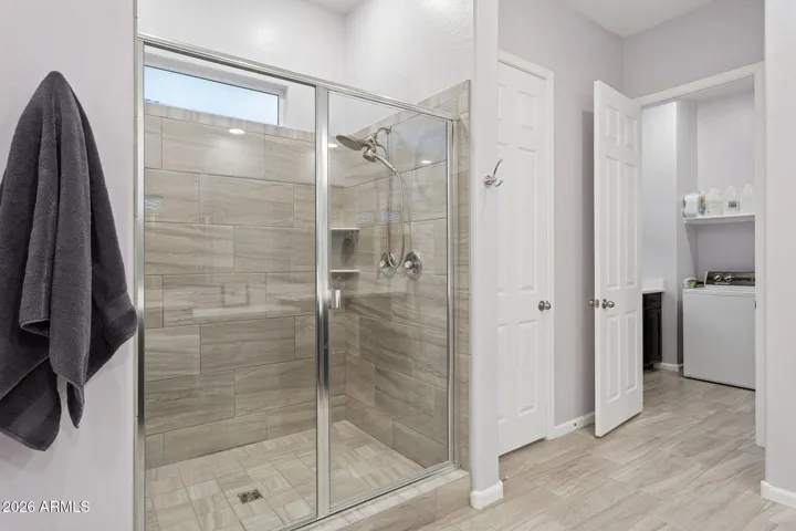 Spacious shower with glass shower door