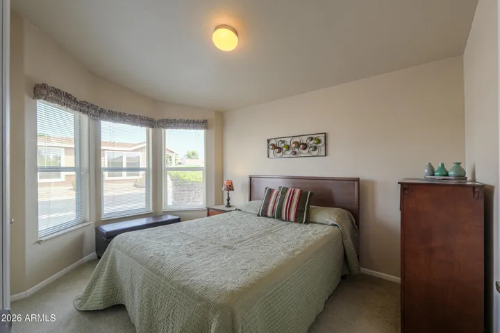 Guest bedroom has a lovely bay window with a view