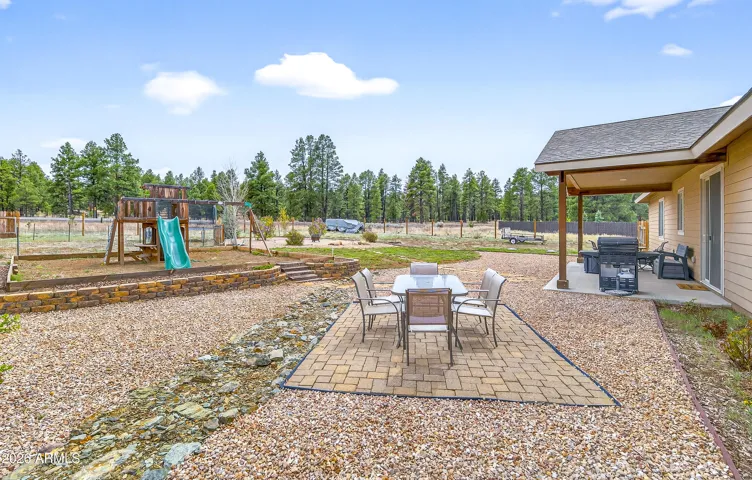 landscaped back yard with fruit trees