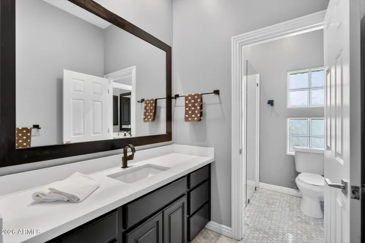 Jack & Jill concept----two separate / private vanities serve each of the bedrooms in the Jack & Jill layout