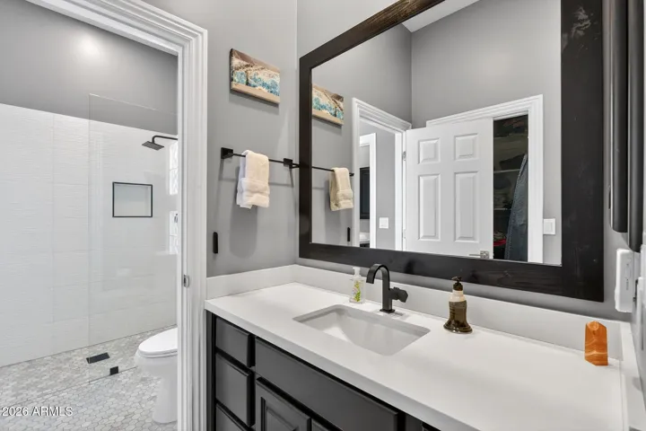 Jack & Jill concept----two separate / private vanities serve each of the bedrooms in the Jack & Jill layout