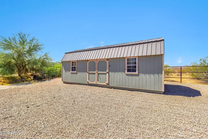 New 12x28 ft outdoor storage shed has two upper storage areas, providing approximately 612 sq ft of versatile extra storage