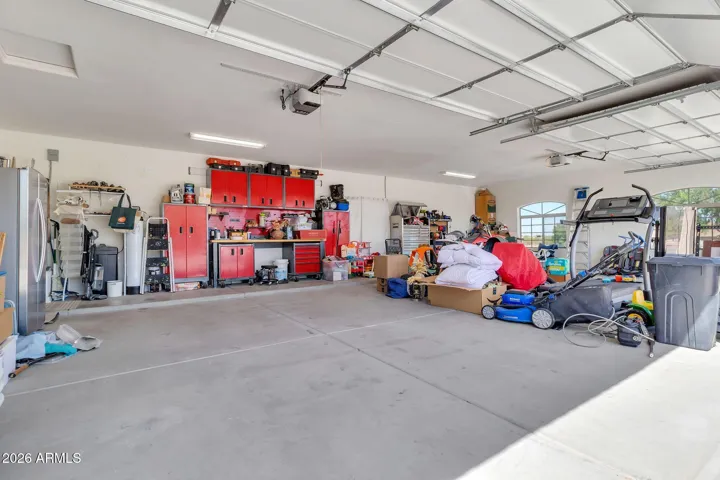 4 Car Extended Garage. Red cabinets convey.