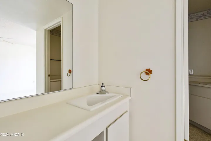 Separate sink leading into Primary Bathroom
