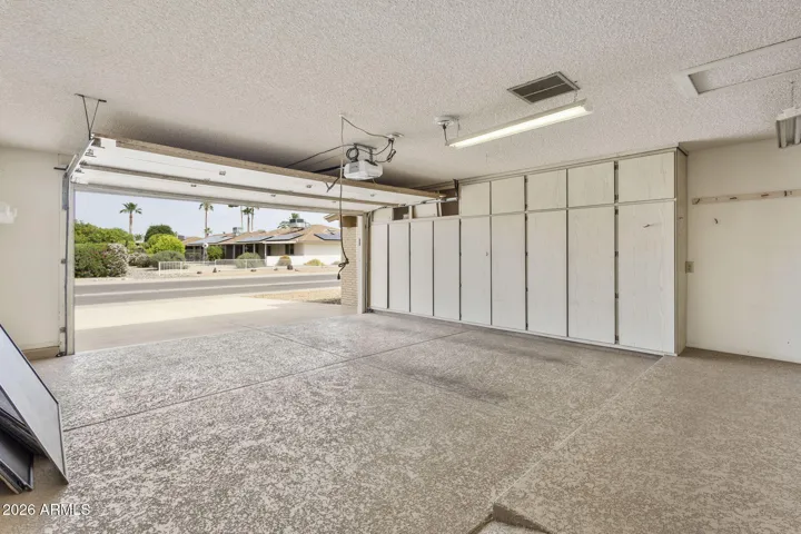 Plenty of cabinets in garage
