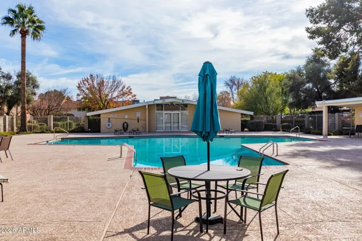 Community Pool with bbq and lounge chairs