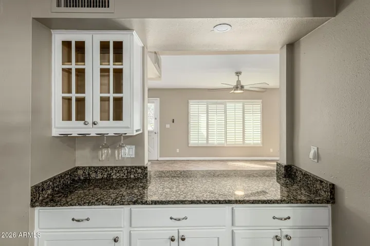Additional Cabinets for Storage both below the countertop and above with glass fronts.