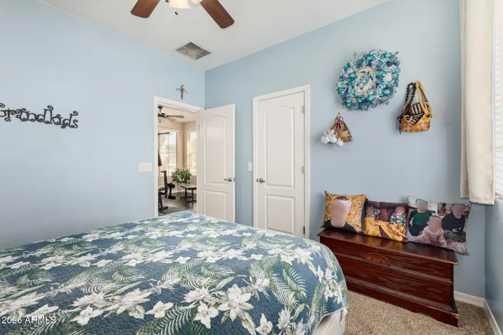 Has calming blue walls with a walk in closet.