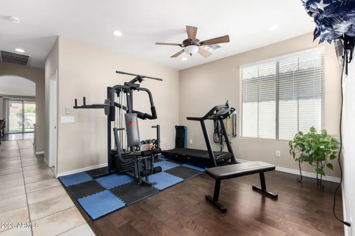 This flex space could easily be enclosed to be another bedroom but is set up as a gym now! Movie room, library, teen room, office, game room and so many options!