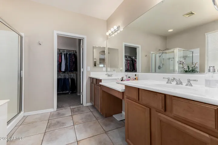Welcome to the primary ensuite with dual sinks, vanity and separate tub and shower!