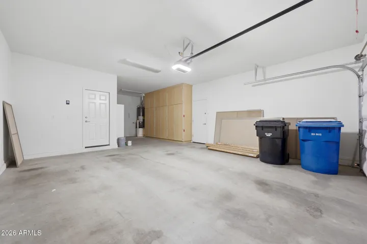 3 Car Garage with Storage Cabinets