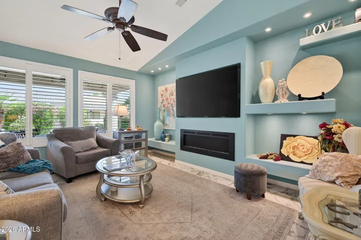 Media art wall with electric fireplace and 75 inch TV