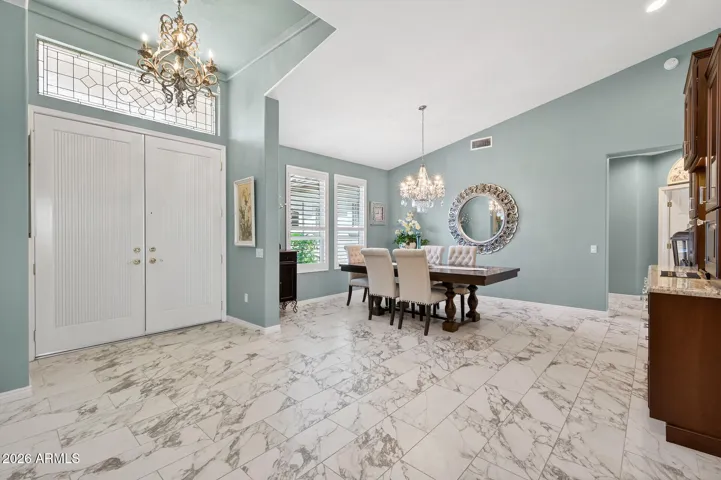 Flooring is white/gray marbled porcelain tile