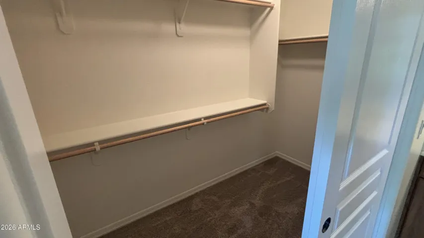 walk in closet in primary bedroom