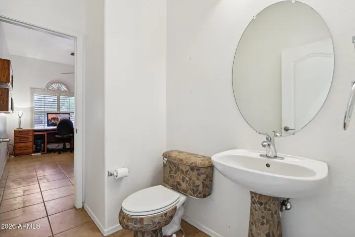 half bath with access to the office and also the hallway