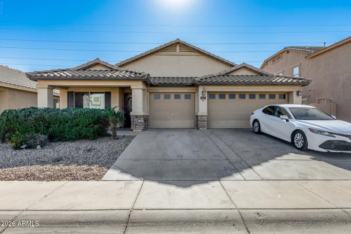 Front: 3 car garage and 3 slab parking