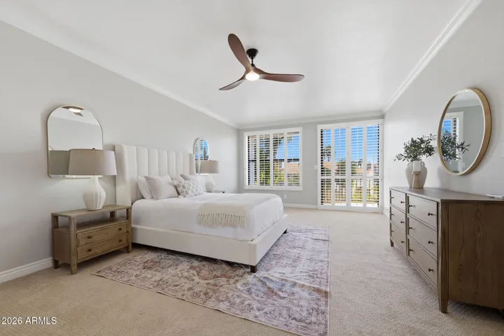 Spacious primary with balcony and dual walk-in closets!