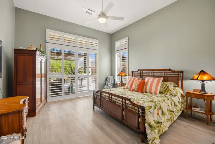 Appreciate view from this lovely suite with a slider to back patio and pool.