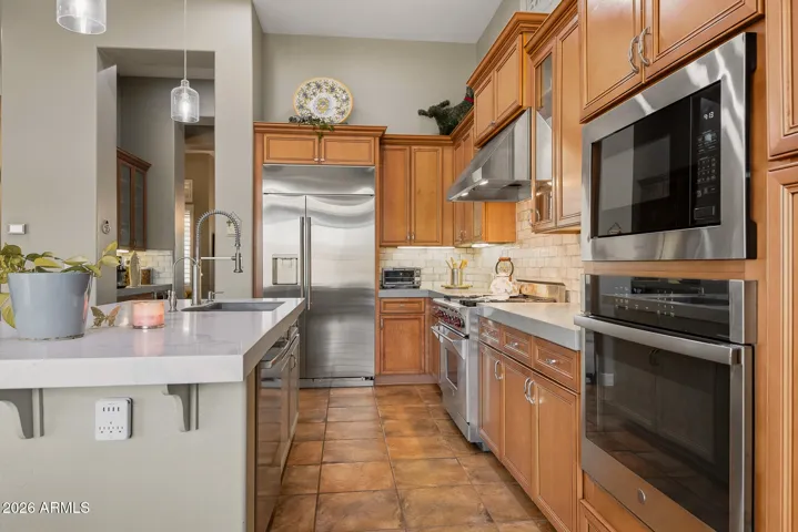 Butler's pantry, pendant lighting, double oven.
