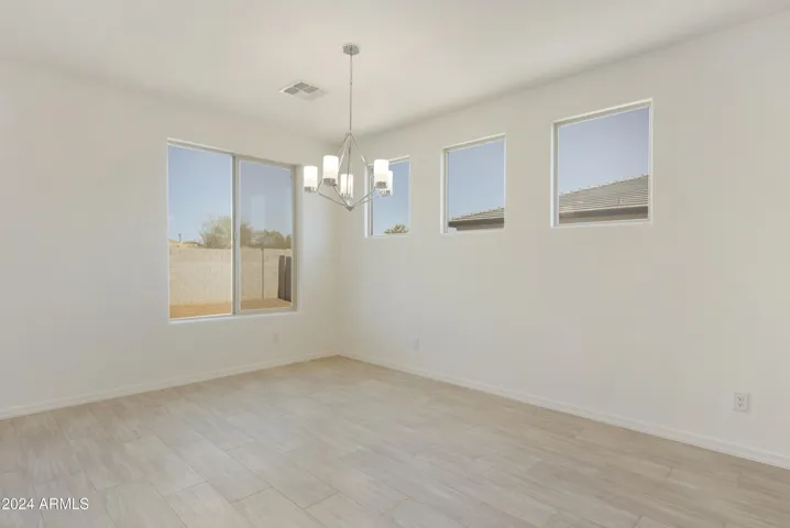 SEAMLESS WOOD PLANK TILE THROUGH OUT THE HOME MINUS THE BEDROOMS!
