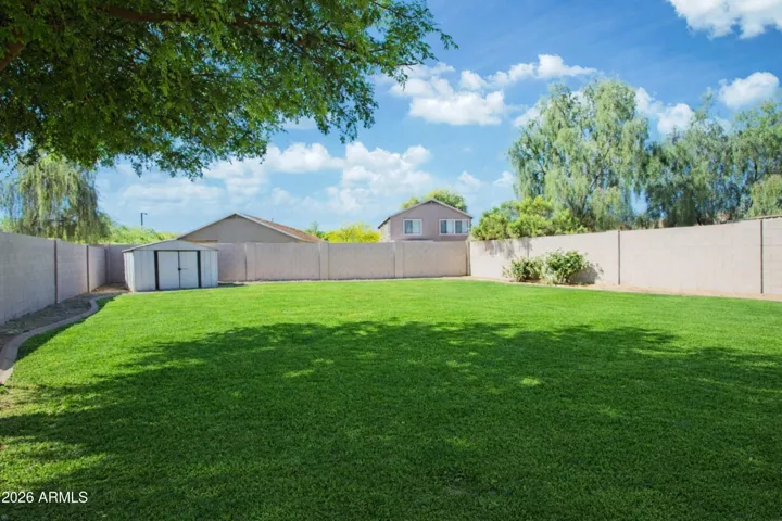 Large back yard with storage shed