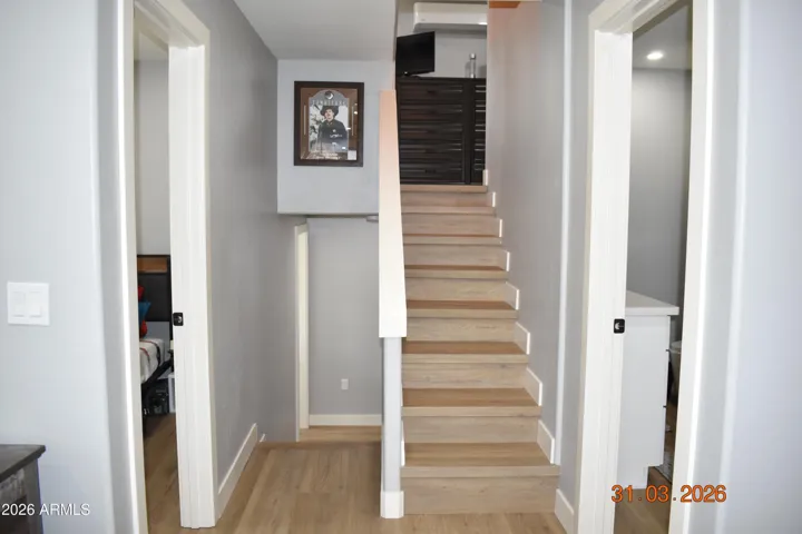 Stairs up to large guest bedroom. Or downstairs to the main bedroom.