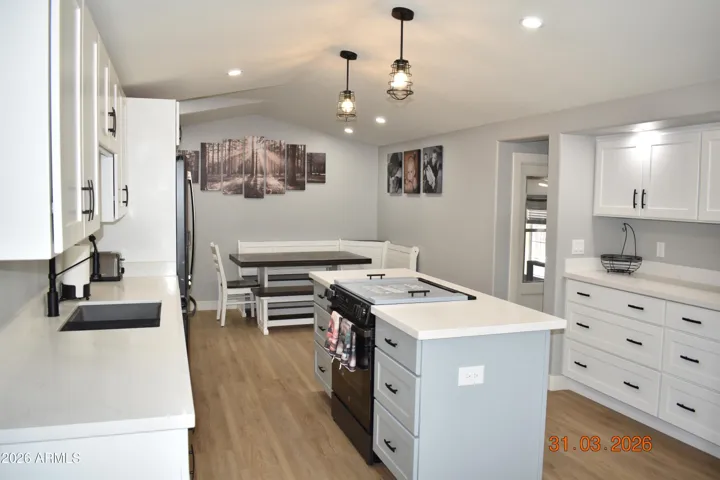 Eat in Kitchen, laundry and large pantry out to storage rm.