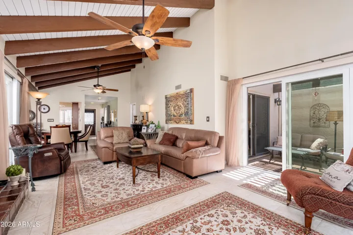 Family room with access to patio area off primary bedroom