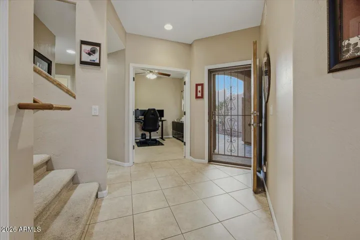 Home has a nice foyer to greet guests. Den office is also located downstairs