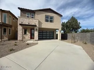 Extended driveway with Portico overhang and sleek modern garage door!