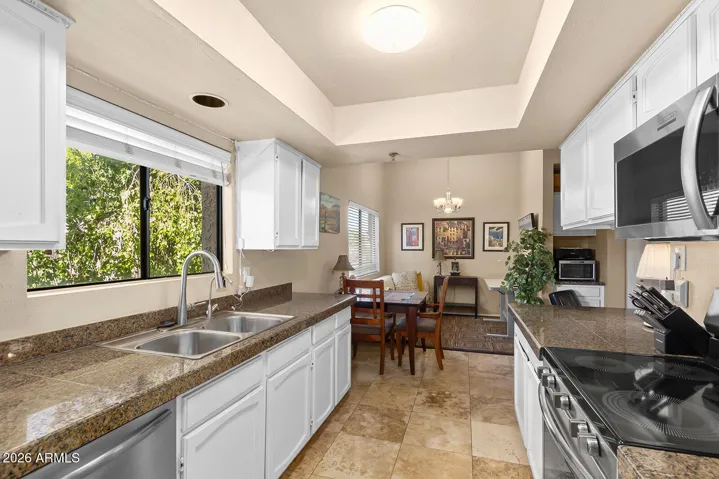 Lush green trees just outside your kitchen window and lots of natural light.
