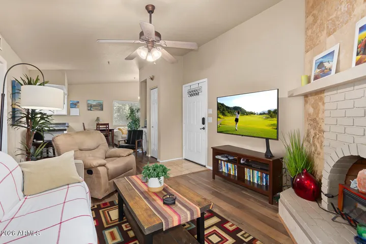 Family room is cozy with a wood burning fireplace.