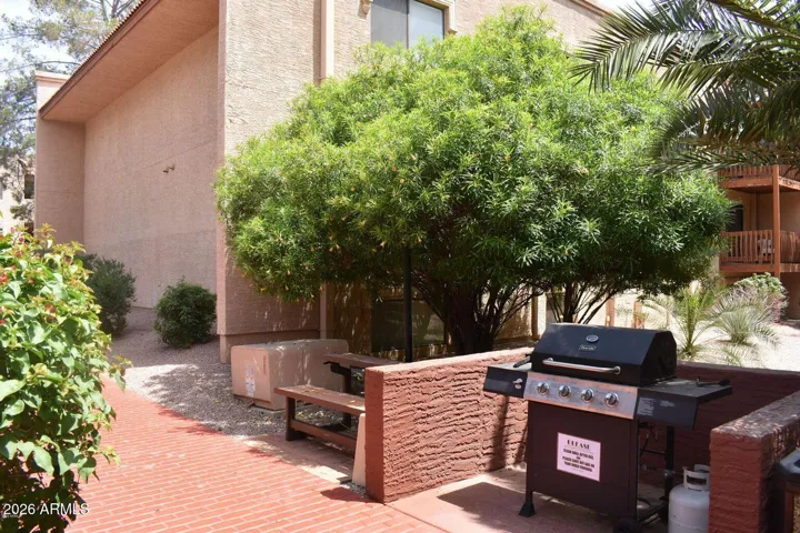 As you walk the lush grounds you see many bbq grills !