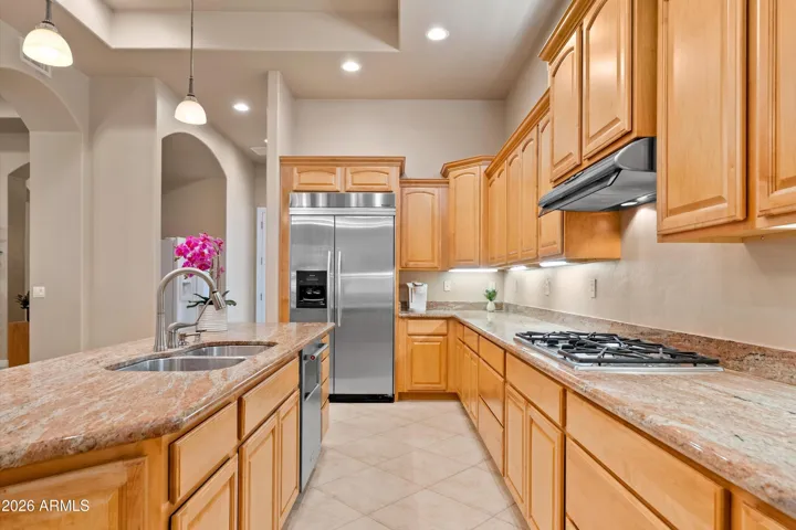 Chefs Gourmet Kitchen. The kitchen features granite countertops, stainless steel appliances, ample cabinetry, and opens perfectly to the main living area.