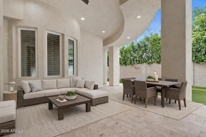 Large covered Patio, Inviting indoor/outdoor living. Step outside to a covered patio and landscaped backyard.