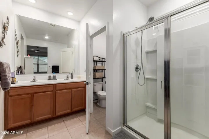 Walk in shower , dual sinks
