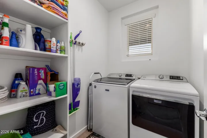 Walk in laundry room with storage