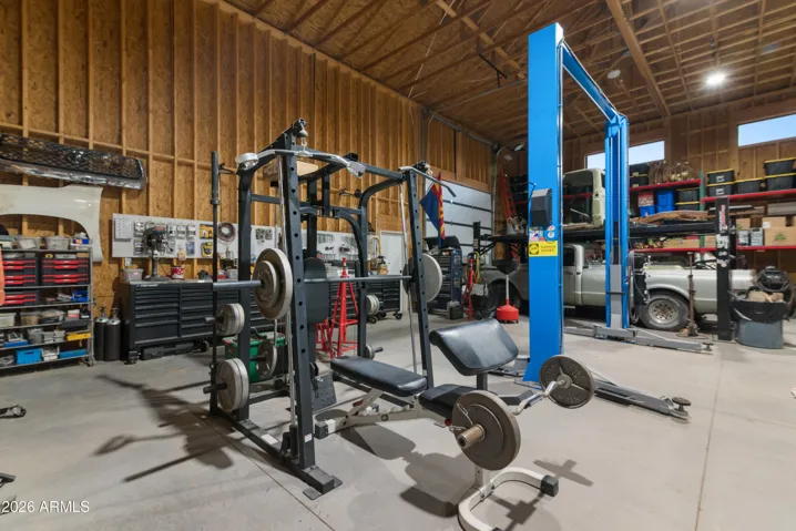Blue 2-post lift conveying in shop