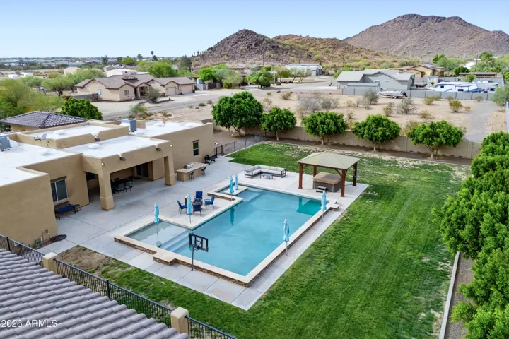 Ficus trees in the backyard for additional privacy; backyard is East facing
