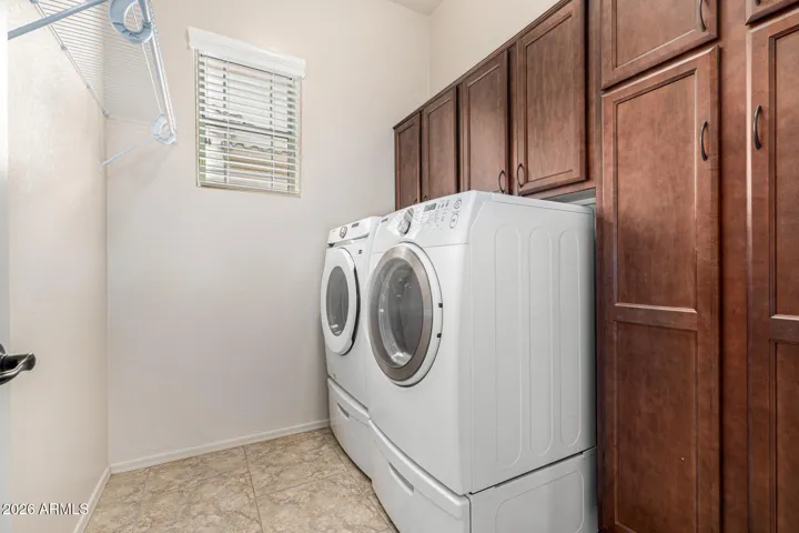 Laundry room with abundance of cabinets